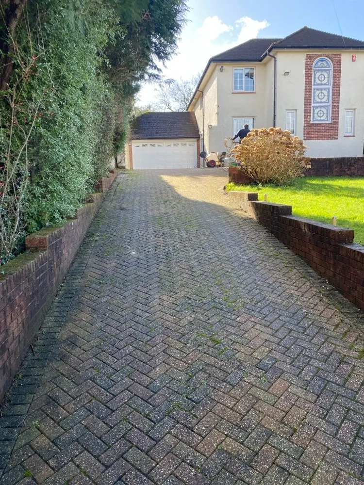A block paving driveway before cleaning