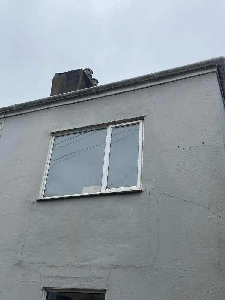 Clean white rendered house wall in Plymouth after softwashing