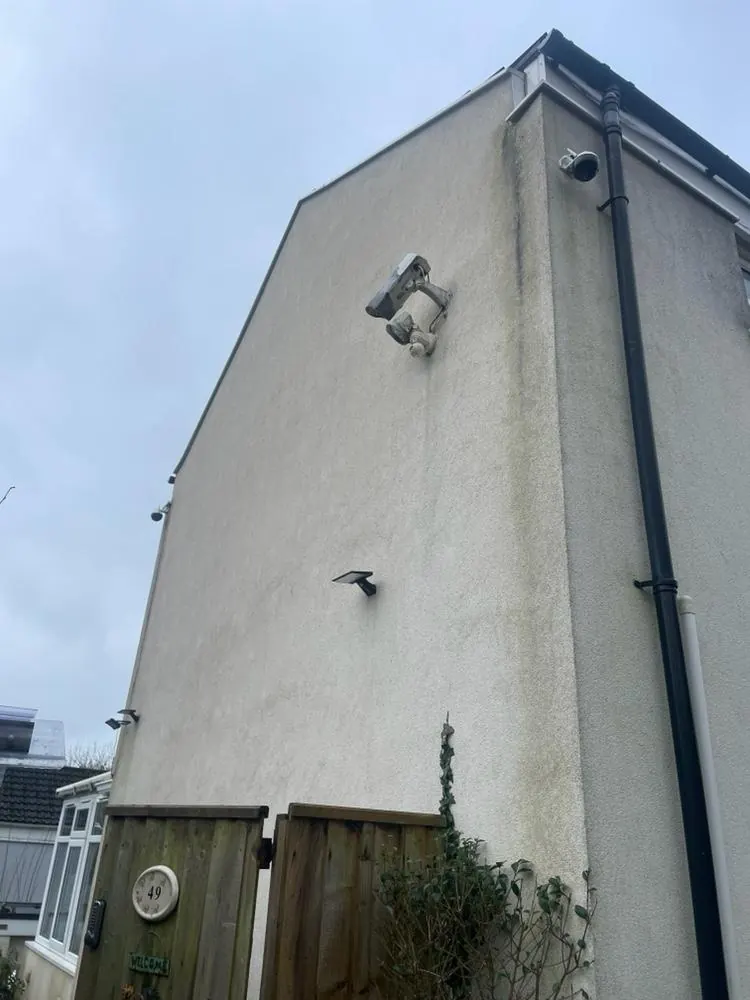 A rendered gable end before cleaning