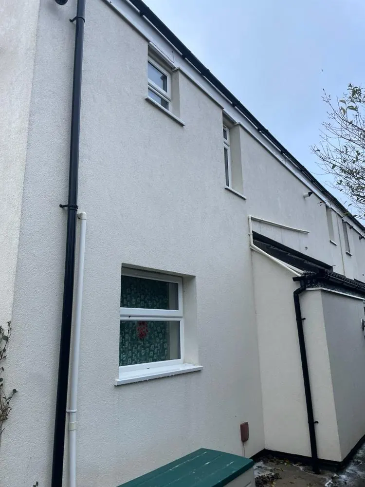 A rendered house wall after cleaning